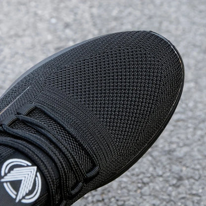 Baskets légères et respirantes en tricot pour hommes, chaussures d'entraînement antidérapantes pour la course à pied, basket-ball, chaussures de sport noires et blanches, semelle en PU